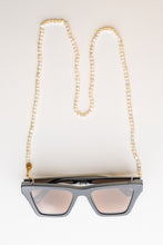 Load image into Gallery viewer, BRAND. The Label Frame chain in natural freshwater pearl. Pictures in the Ivory colour with gold hardware. Can be used as a frame chain or sunglass chain to protect your eyewear. A unique piece from BRAND. The Label resort wear collection. 
