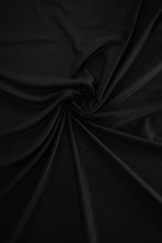 Load image into Gallery viewer, Close up of Black silk and cotton blend fabric. Organic and made in Australia. For intimates set and lounge wear set. BRAND The Label luxury resort wear. 
