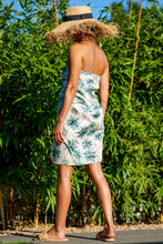 Load image into Gallery viewer, BRAND The Label - Palm print Pareo wrapped around the chest for a chick dress look. One of many styling options with our Lux Sarong 
